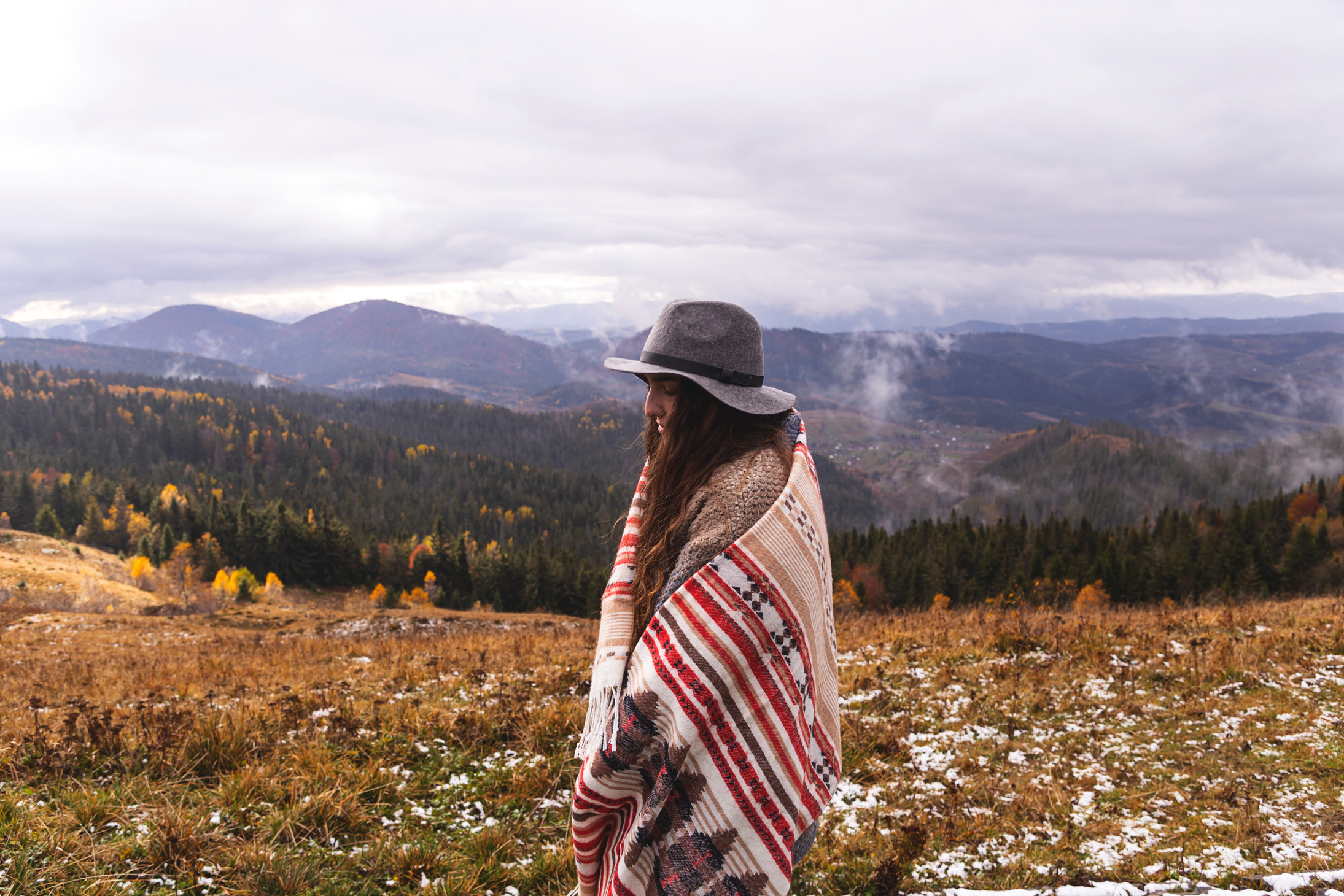 Portrait of a Woman in Boho Outfit on the Mountain