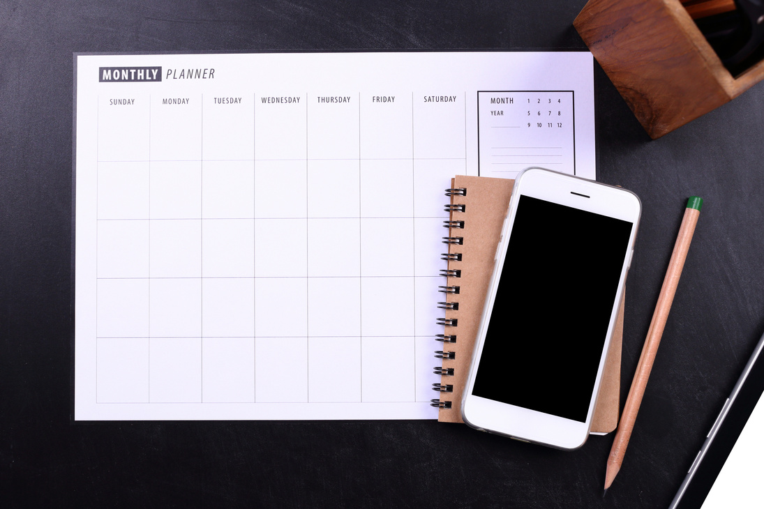 Blank Screen Smartphone with Notebook and Planner Schedule